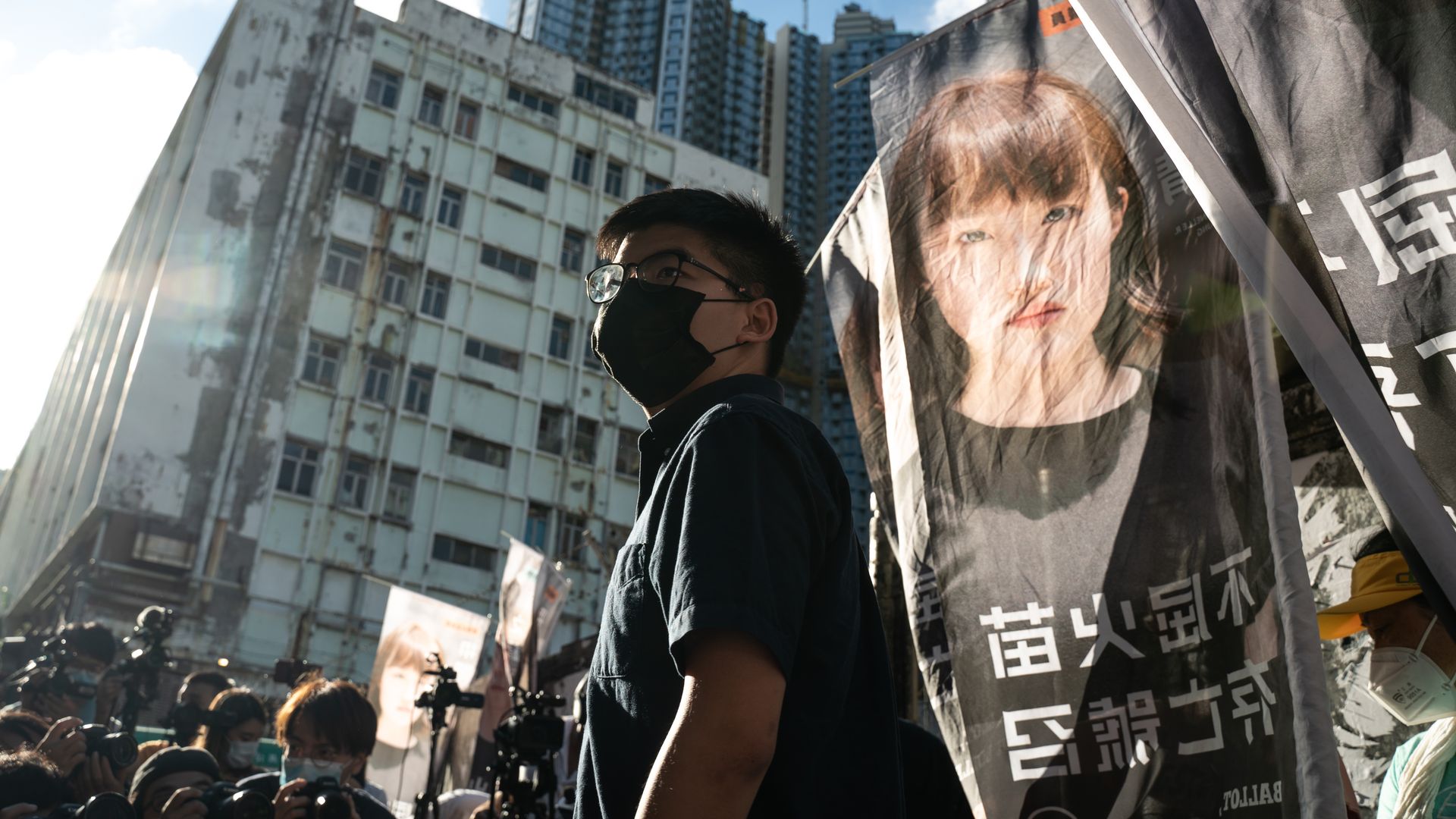 Pro-democracy activist Joshua Wong speaks to members of media during a press conference