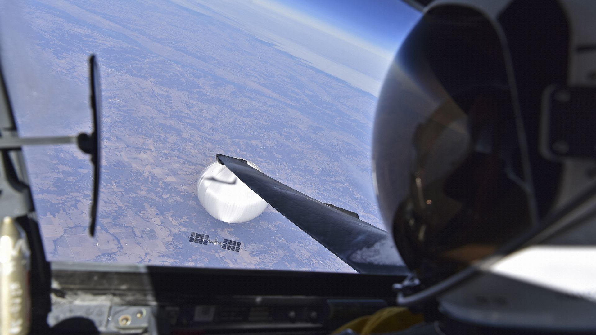  In this handout image provided by the Department of Defense, a U.S. Air Force U-2 pilot looks down at the suspected Chinese surveillance balloon on February 3, 2023 as it hovers over the Central Continental United States. 