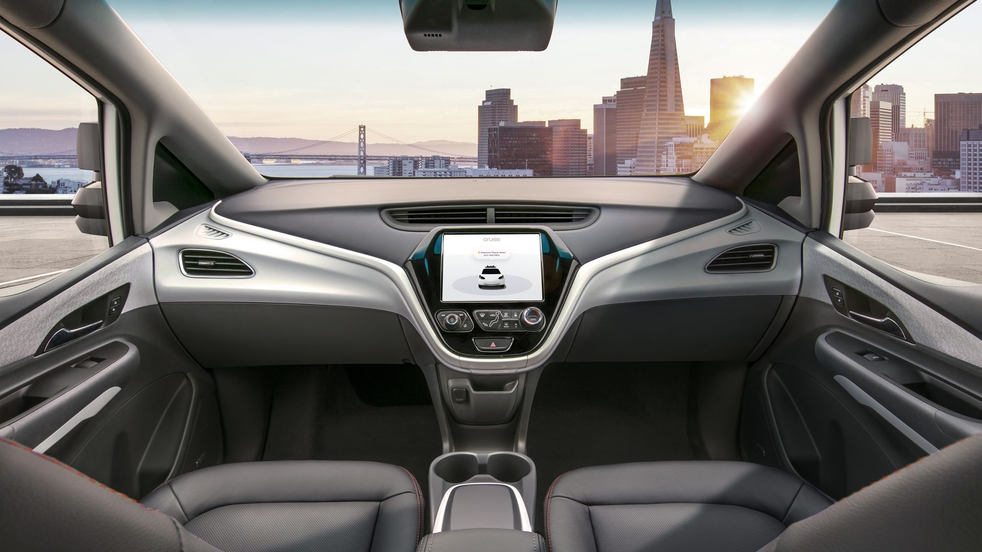 Image of interior of GM Cruise's self-driving car, with no steering wheel or pedals.