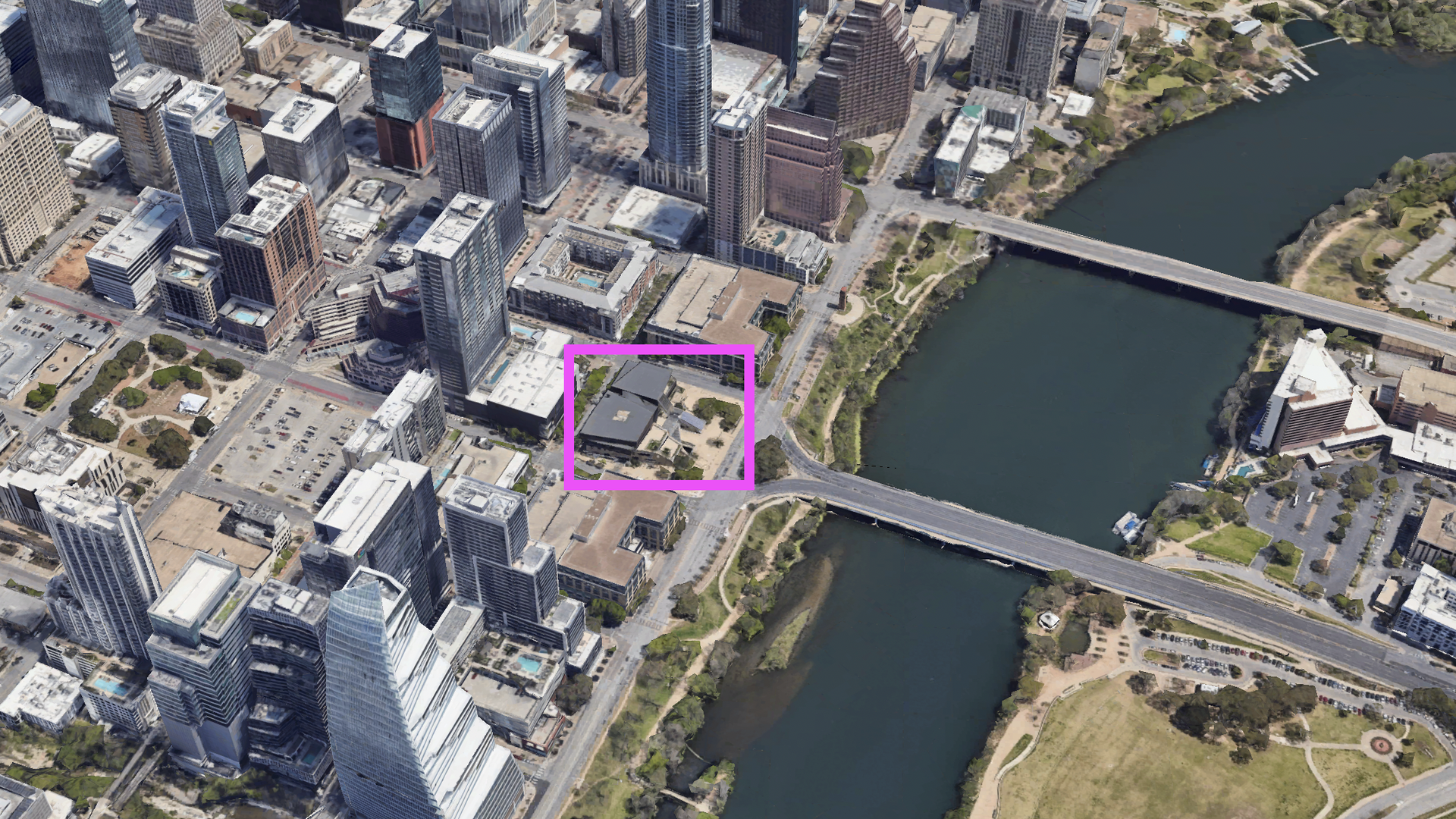 A Google Earth image of downtown Austin, with a magenta box around a city block.