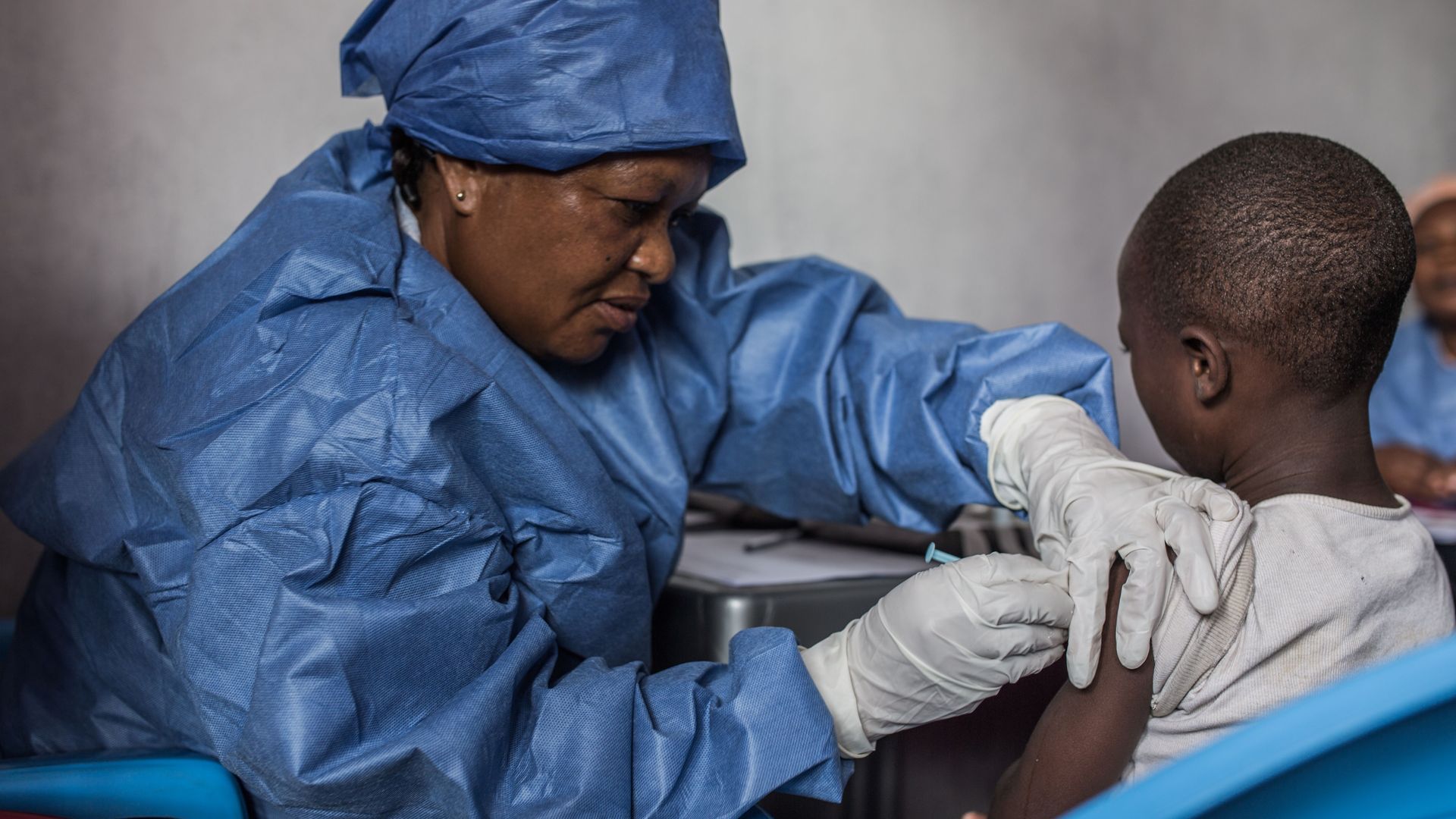 A girl is getting inoculated with an Ebola vaccine on November 22, 2019 in Goma. 