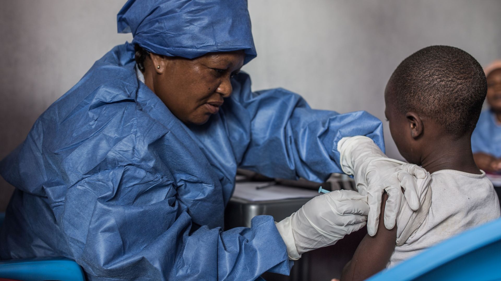 A girl is getting inoculated with an Ebola vaccine on November 22, 2019 in Goma.