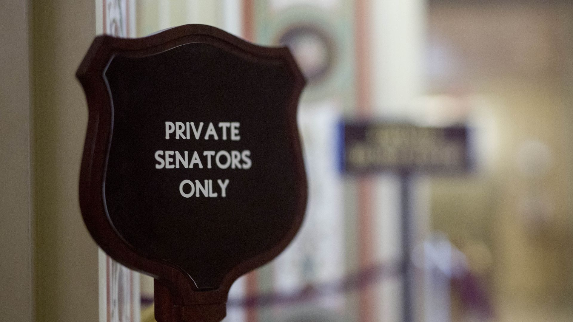 "Senators Only" sign in Capitol hallway