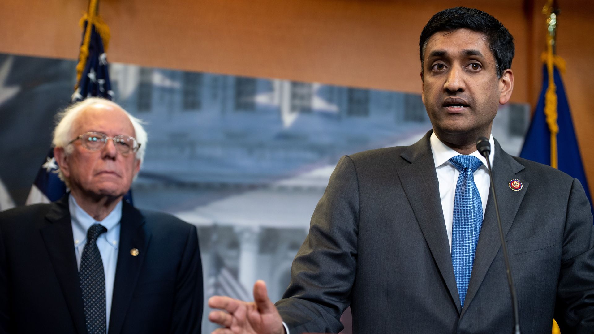 Sen. Bernie Sanders and Rep. Ro Khanna are seen addressing reporters.