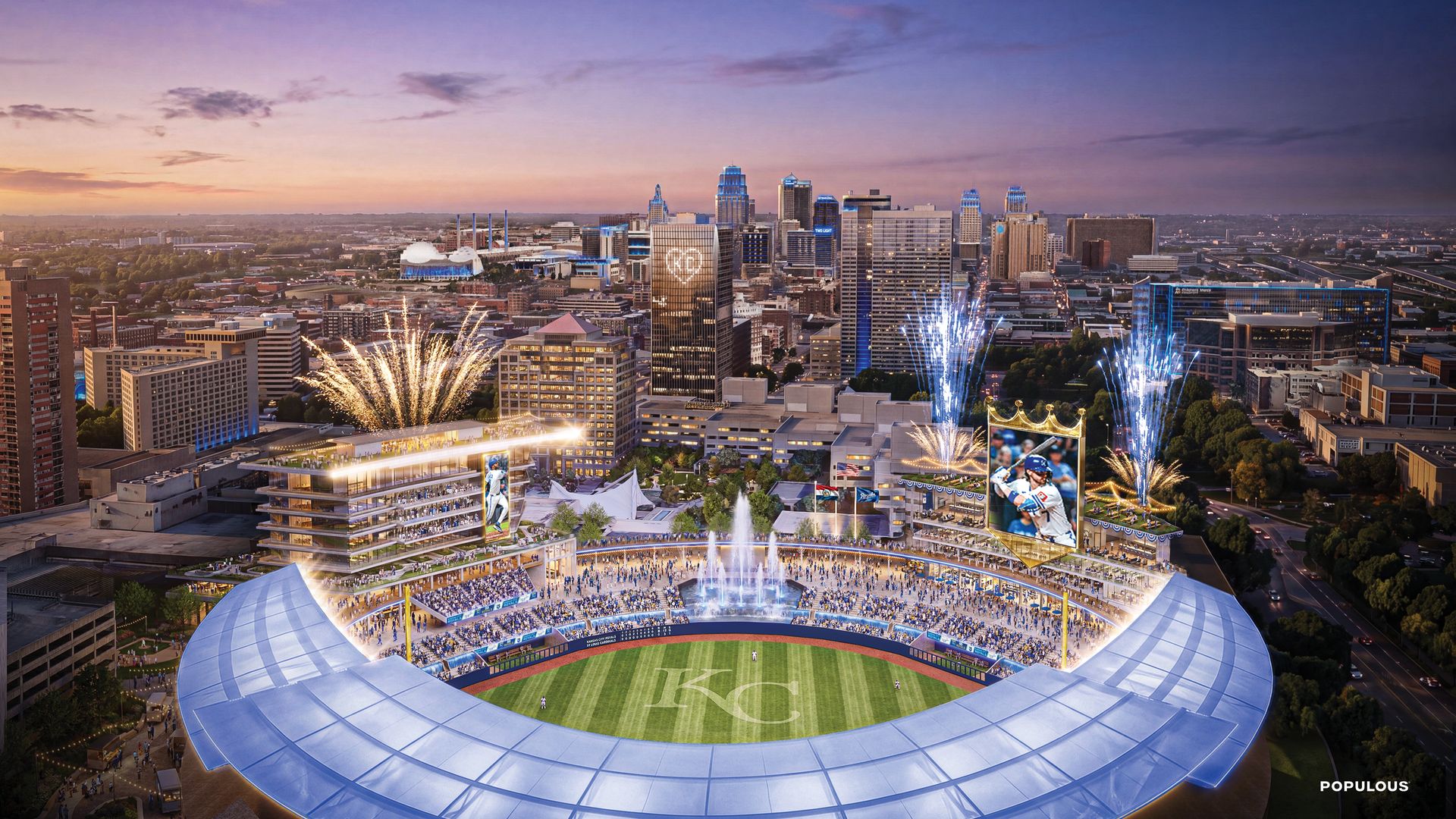 Panoramic city skyline at sunset behind a large open-roof baseball stadium; fireworks light the sky as crowds cheer, with a KC emblem visible on the grass.