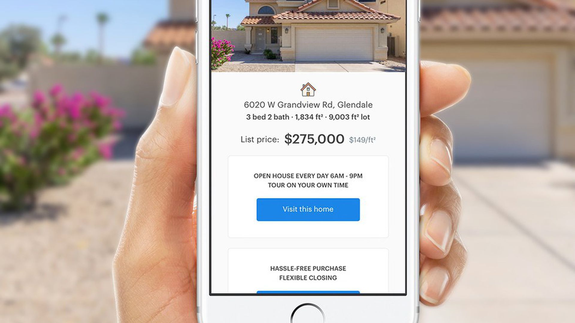 Hand holding Opendoor's home-buying mobile app. 