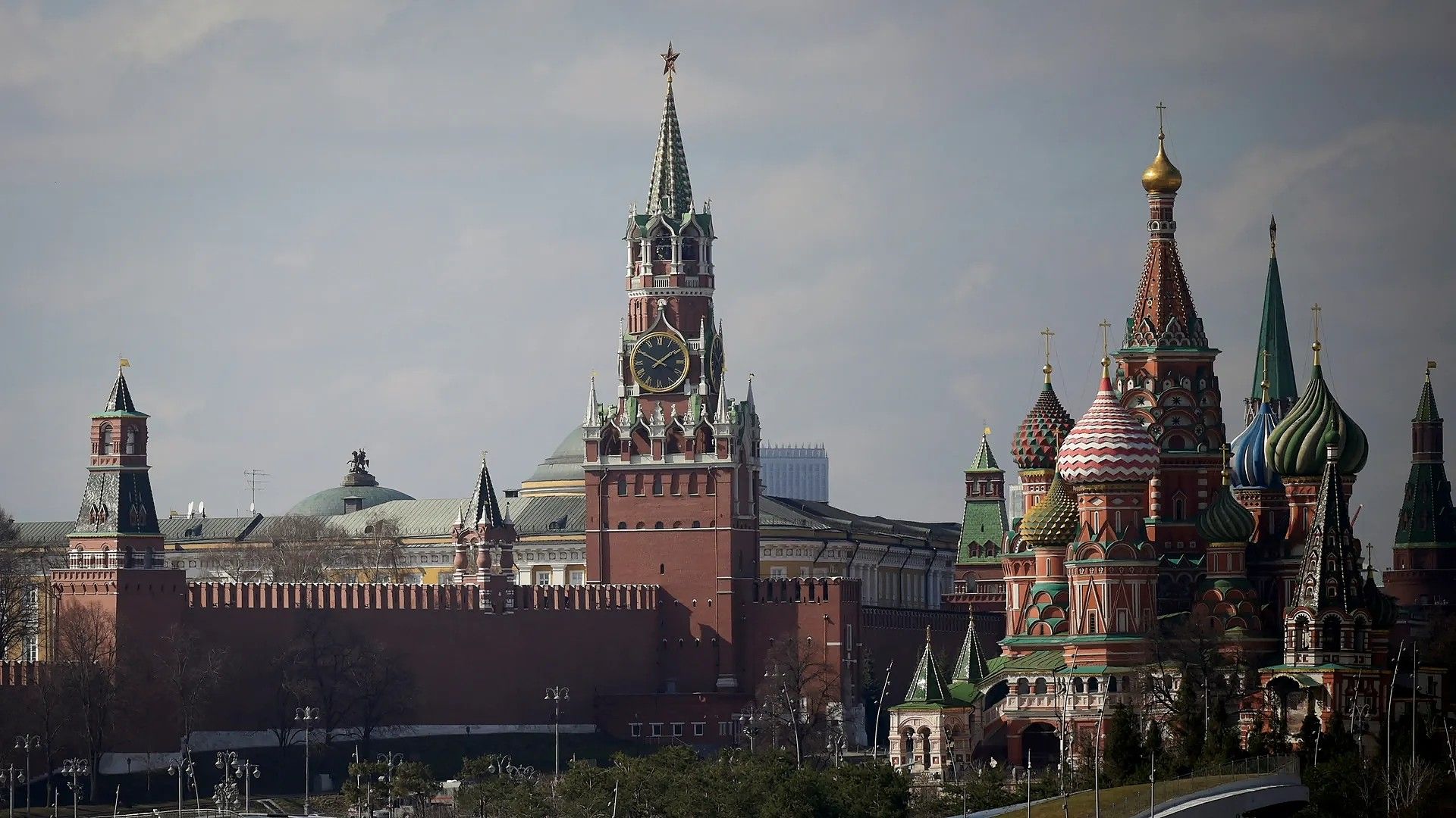 View of the Kremlin with Spasskaya Tower and St. Basil's Cathedral in downtown Moscow. 