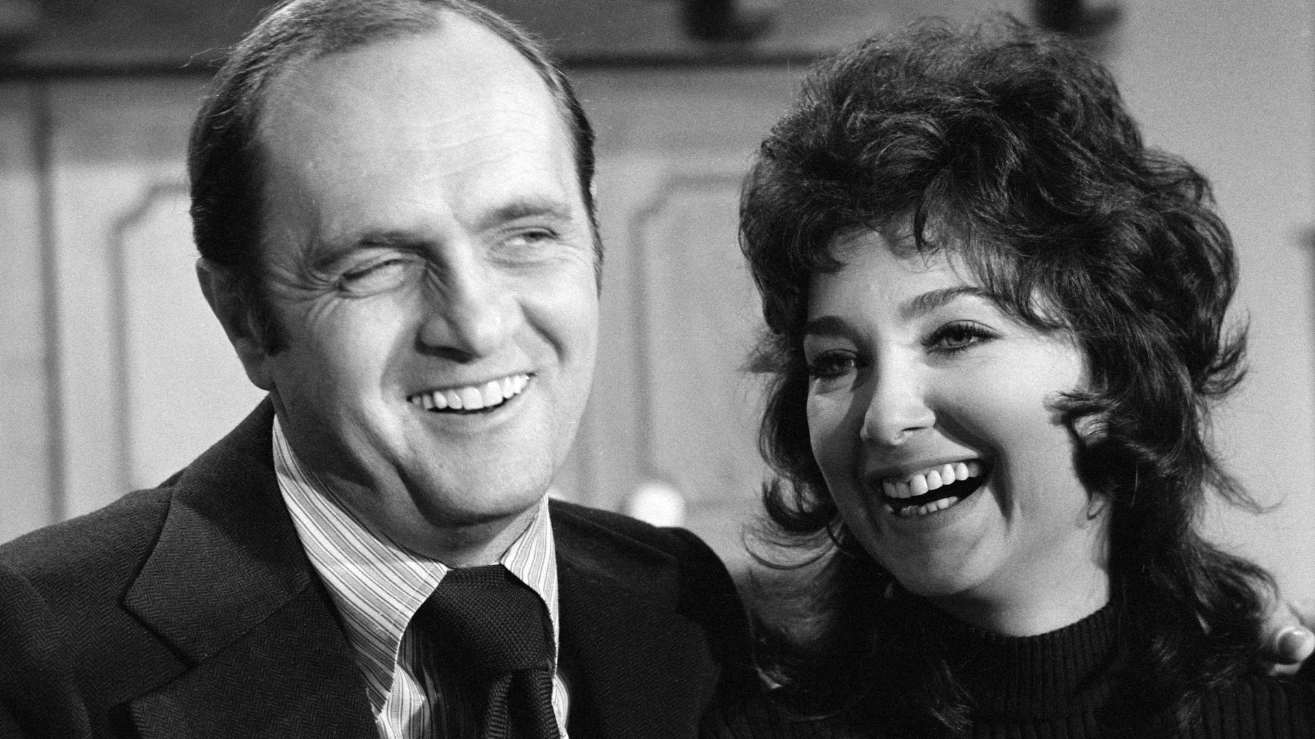 Photo of two people laughing 