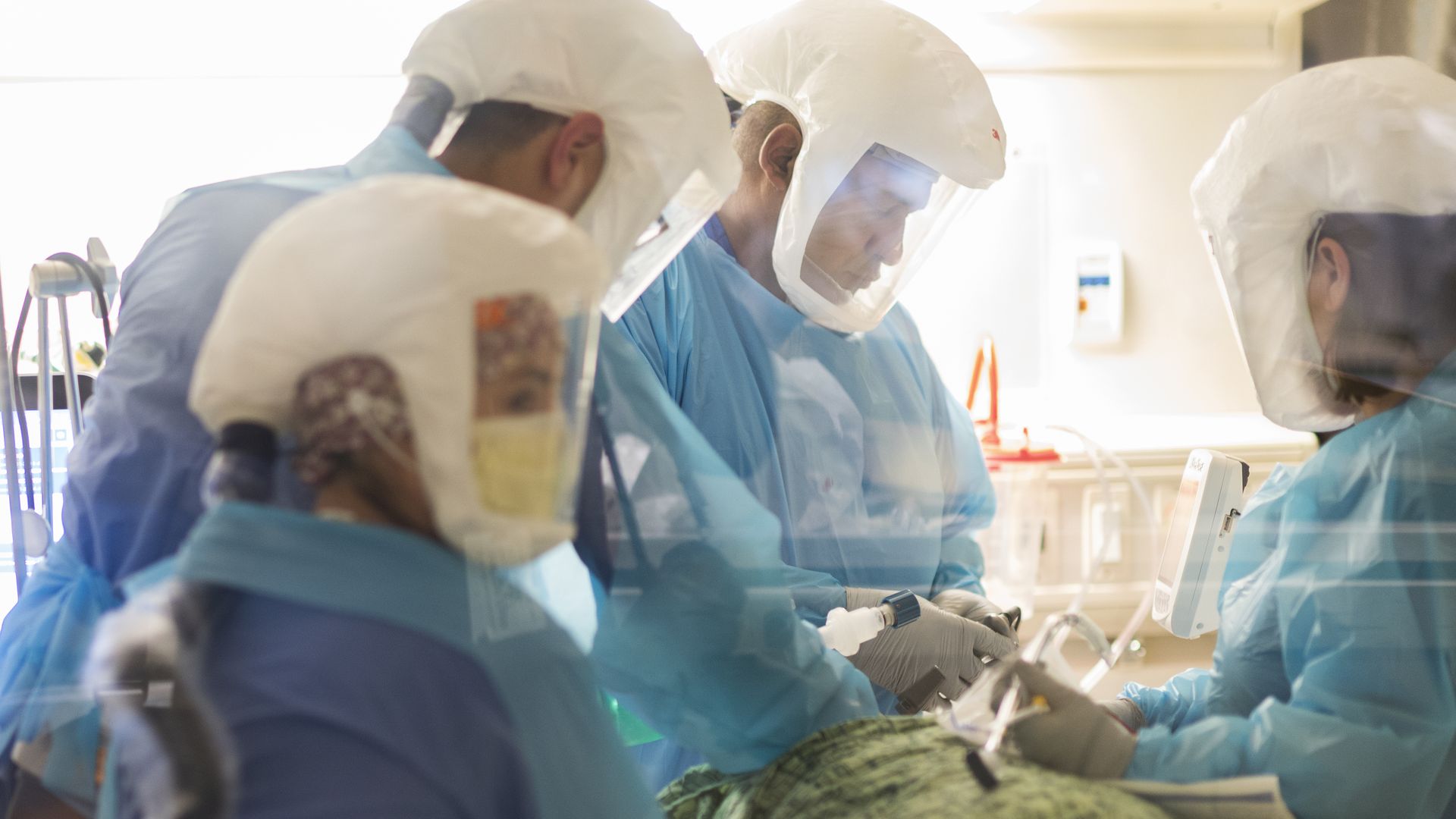 Healthcare workers incubate a patient at the Covid-19 Intensive Care Unit (ICU) of Salinas Valley Memorial Hospital in Salinas, California, U.S., on Tuesday, Jan. 26, 2021.