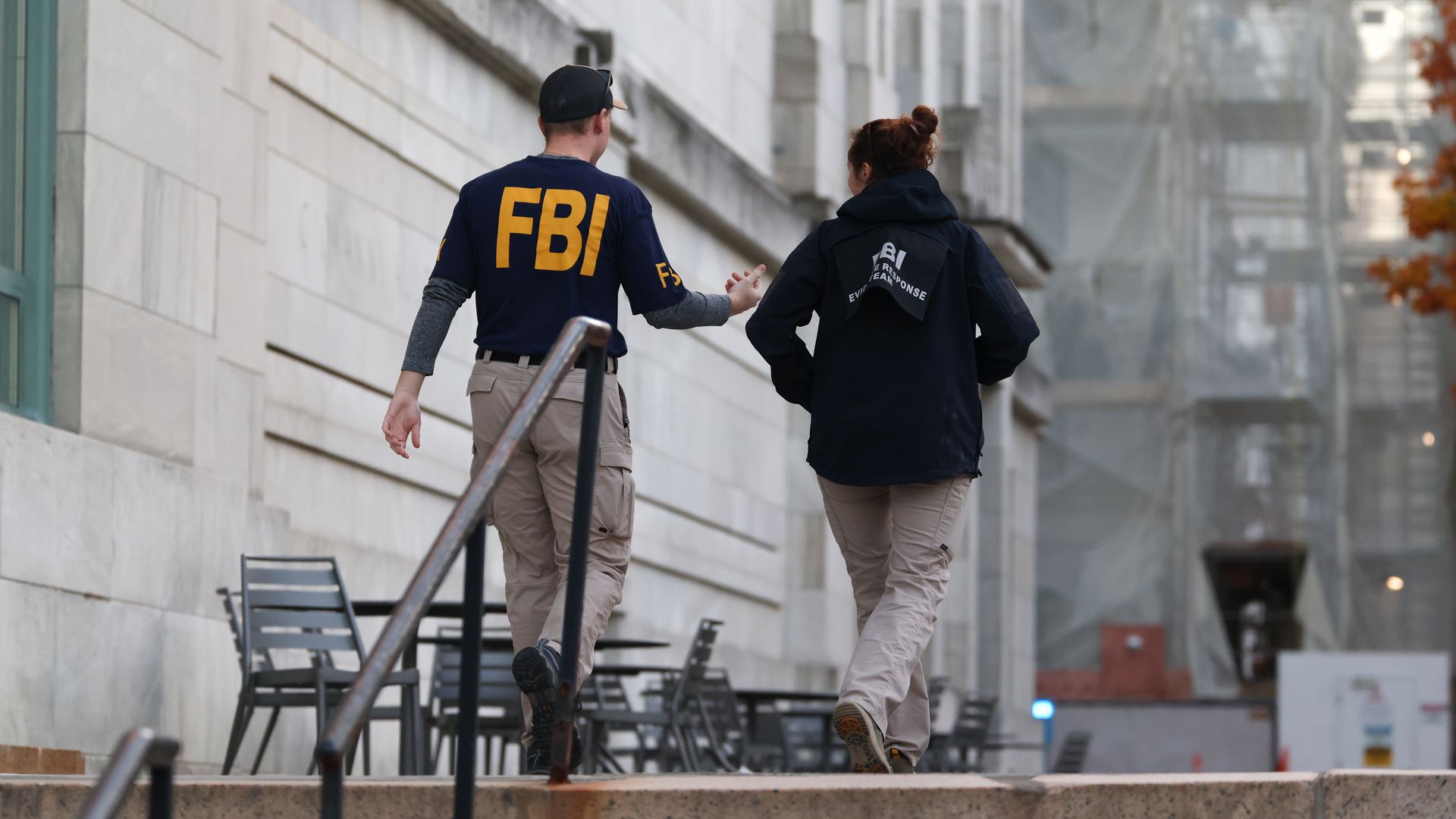 An FBA agent, left, and another public safety official, right, walk up the steps at Harvard Medical School on Nov. 1, hours after an explosion. 
