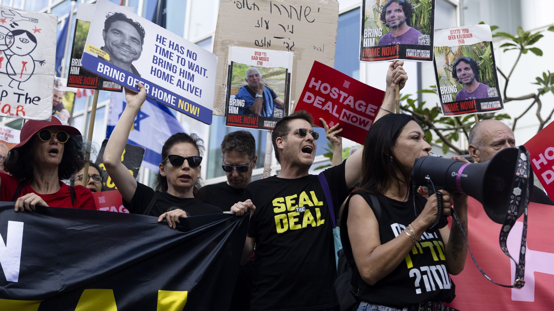 Families of hostages held in the Gaza Strip by Hamas and supporters protest near the hotel of US Secretary of State Antony Blinken during his visit to the country on June 11, 2024 in Tel Aviv, Israel. 