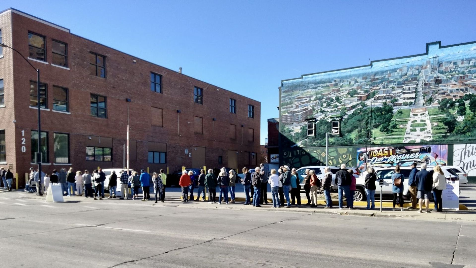 A photo of people waiting in line to vote.
