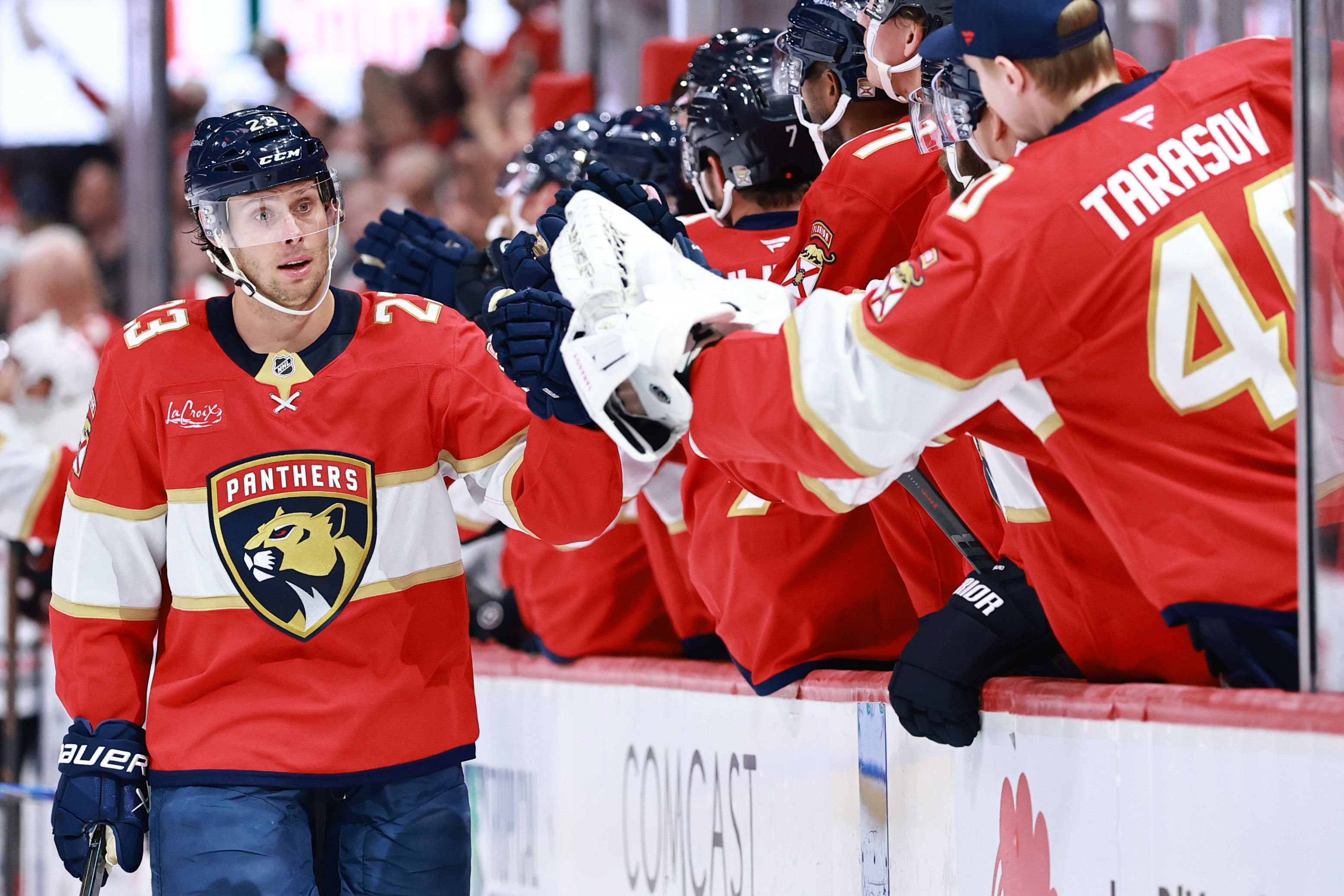SUNRISE, FLORIDA - OCTOBER 07: Carter Verhaeghe #23 of the Florida Panthers high fives teammates after scoring against the Chicago Blackhawks during the first period at Amerant Bank Arena on October 07, 2025 in Sunrise, Florida. (Photo by Carmen Mandato/Getty Images)

