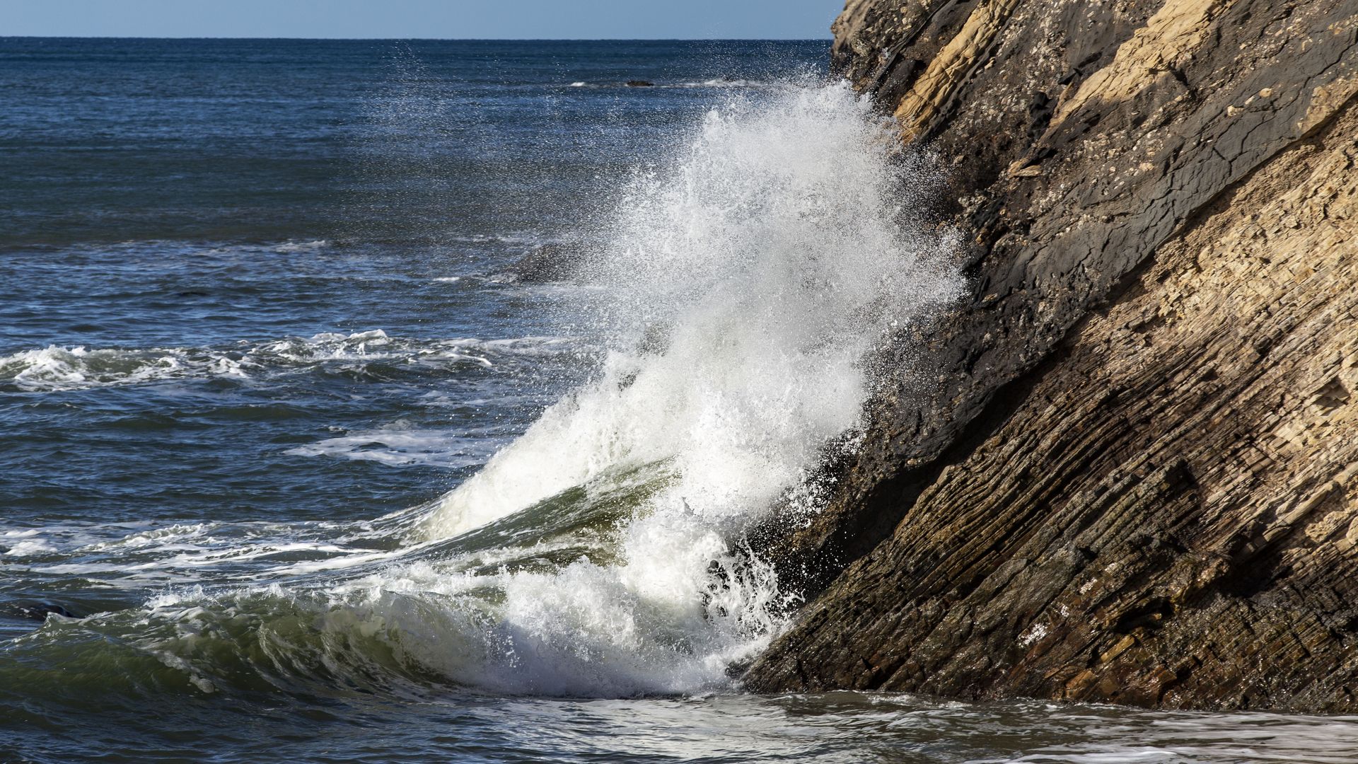 Large waves batter the beach