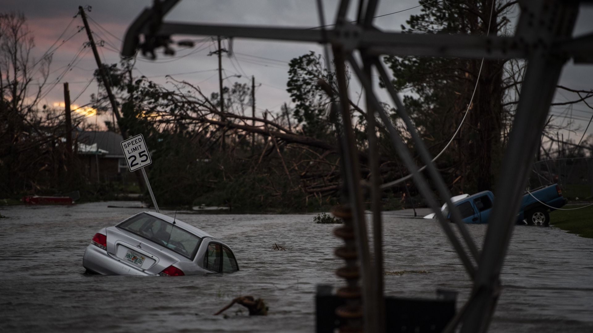 Photo of car submerged in flood waters and electricity pole tilted in Panama City after Hurricane Michael