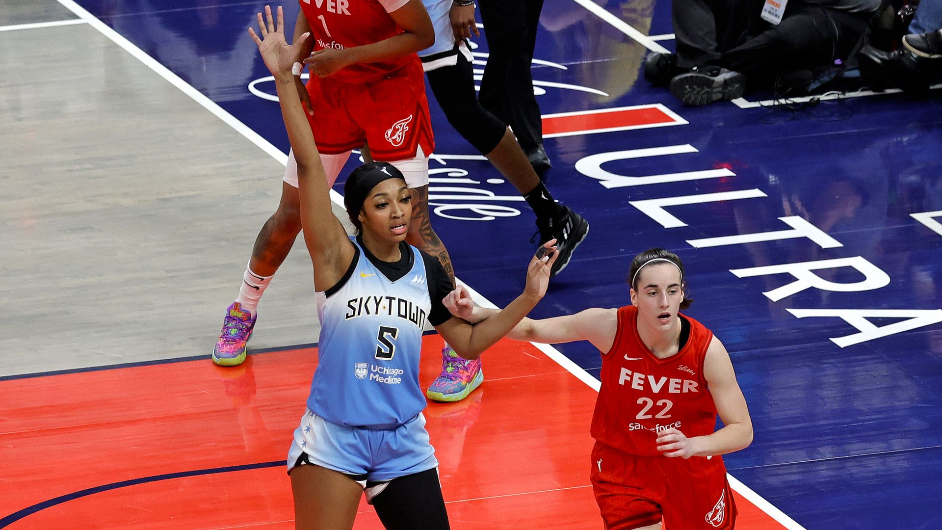 Chicago Sky forward Angel Reese (5) is guarded by Indiana Fever guard Caitlin Clark (22) on June 1, 2024, at Gainbridge Fieldhouse in Indianapolis, Indiana. 