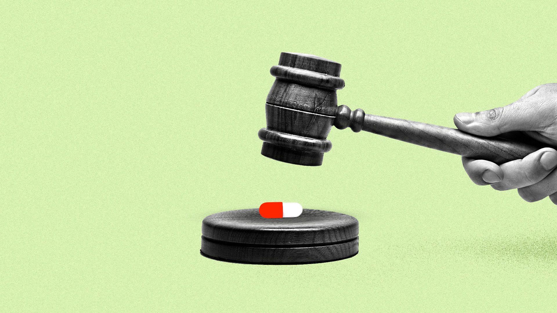 A judge's gavel about to crush a red and white pill.