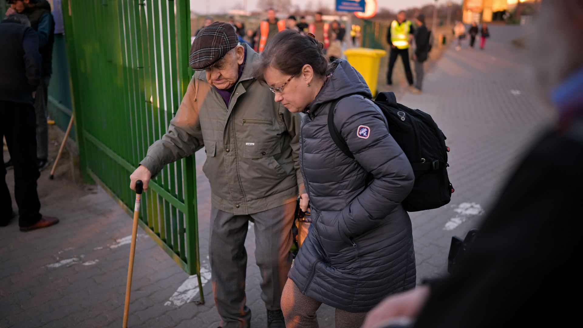Ukrainians are seen walking across the Polish border as they fled Russia's invasion of their country.
