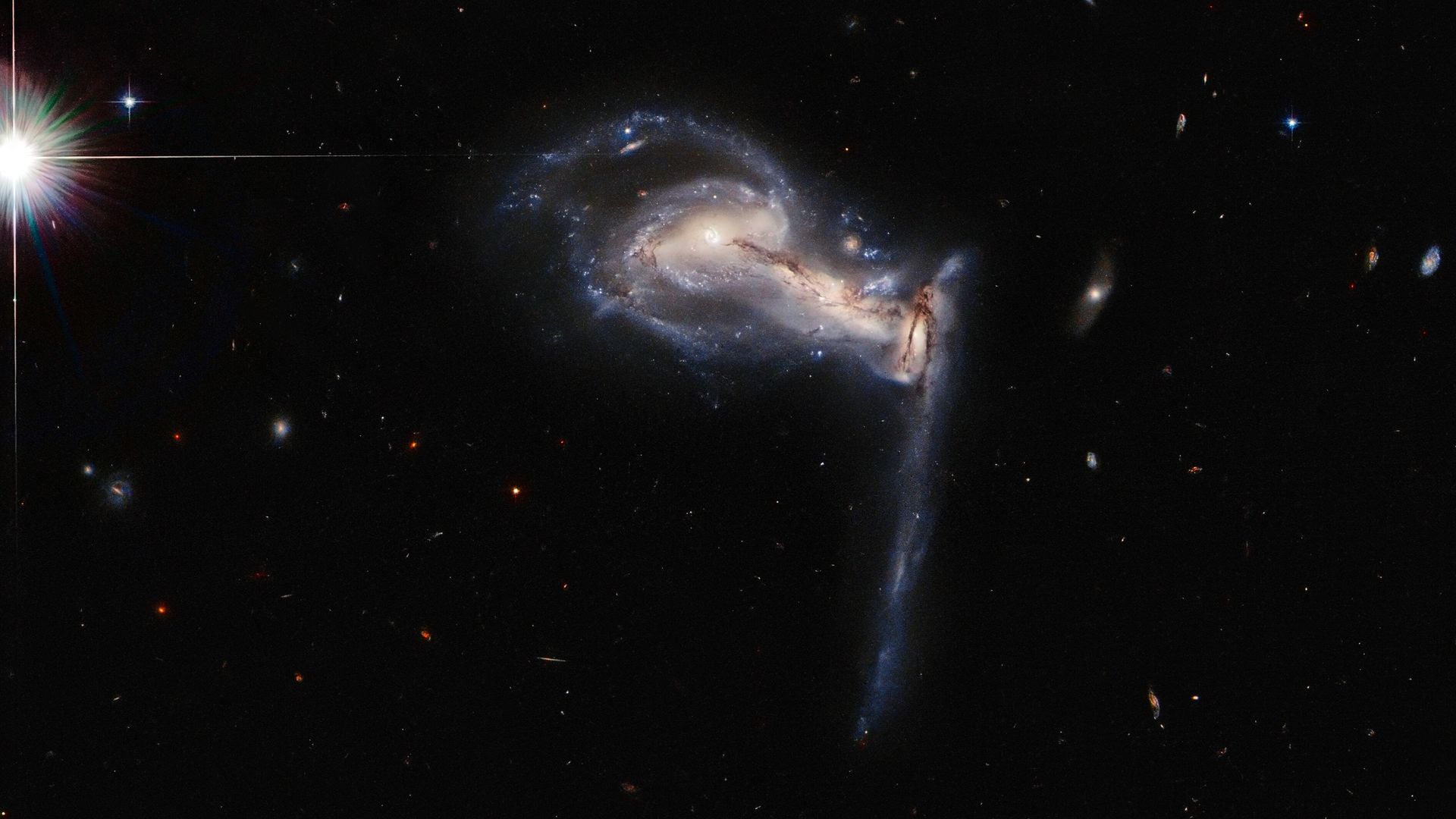 A trio of galaxies interacting as seen by the Hubble Space Telescope