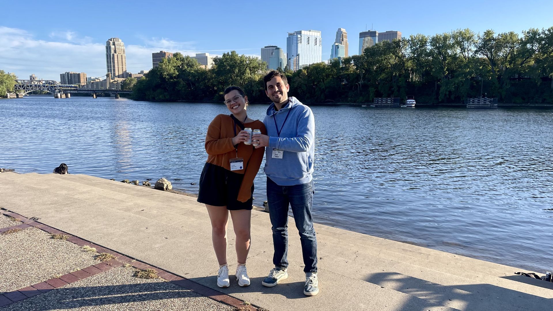 Zach and Lucille, with the Minneapolis skyline and the Mississippi River behind them