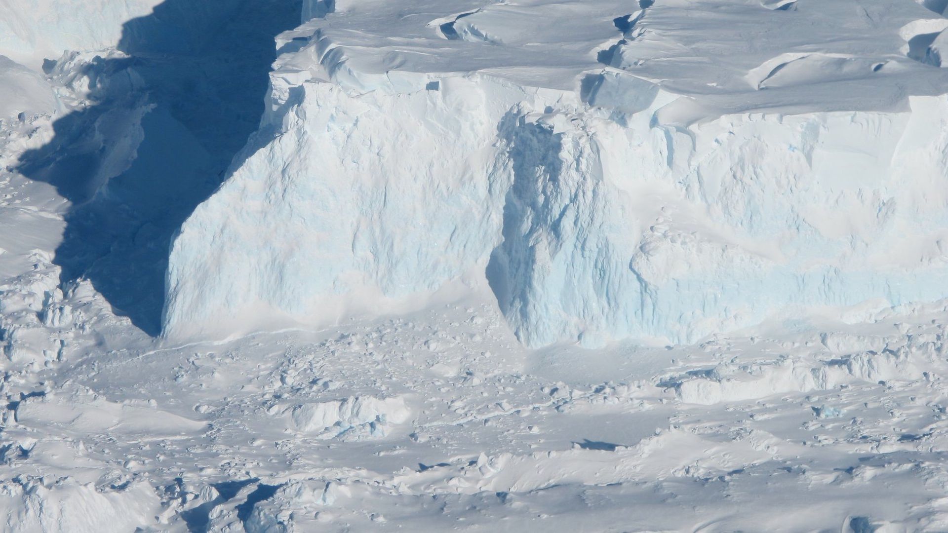 Aerial view of the cliffs at the edge of the Thwaites Ice Shelf in West Antarctica.