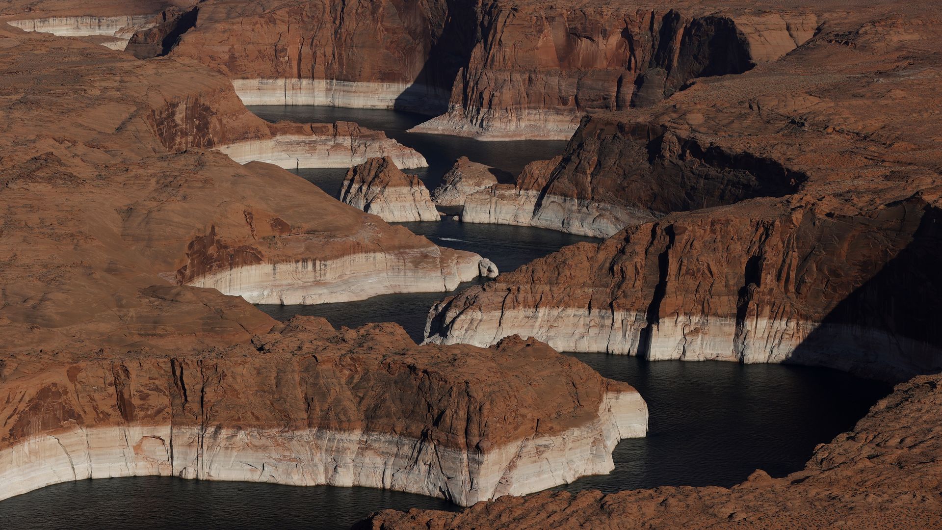 Aerial photo showing low levels of a lake, drained by drought.