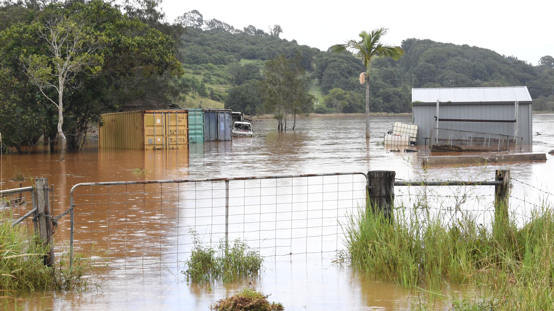  Flooded farm buildings and crates on March 29, 2022 in Ballina, Australia.