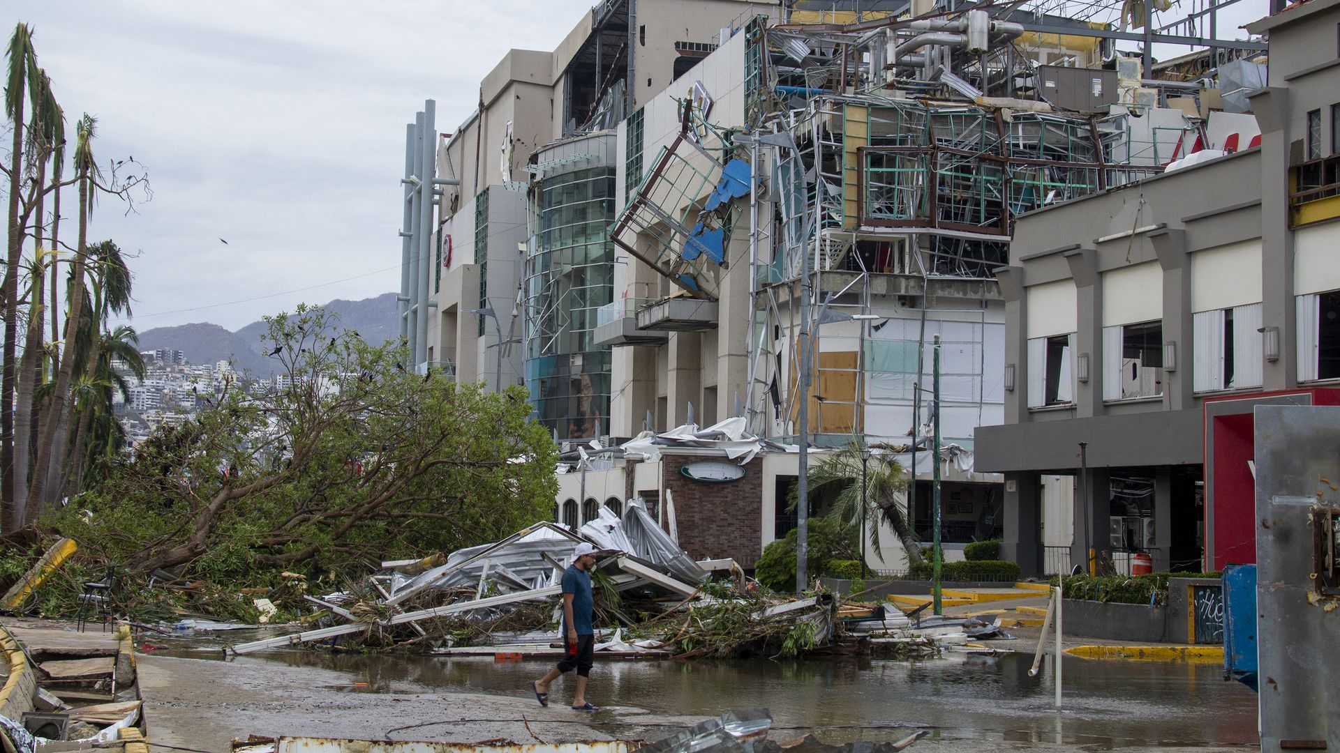 A man walks amid hurricane wreckage in Acapulco, Mexico after the storm hit on Oct. 25. 