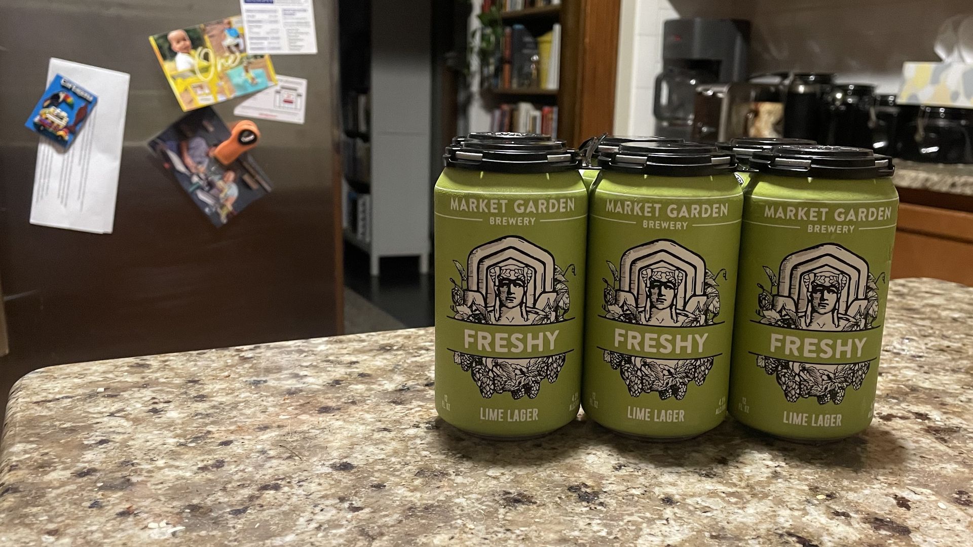 Six pack of beer in green cans