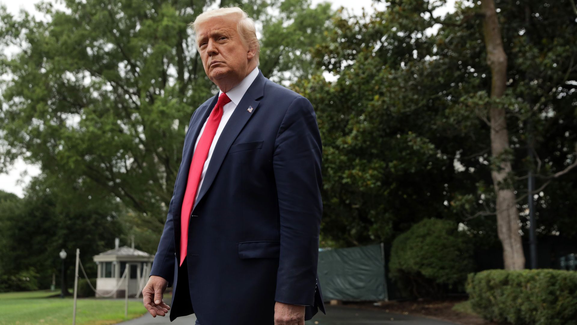 President Donald Trump comes out from the residence prior to a Marine One departure from the South Lawn of the White House July 31