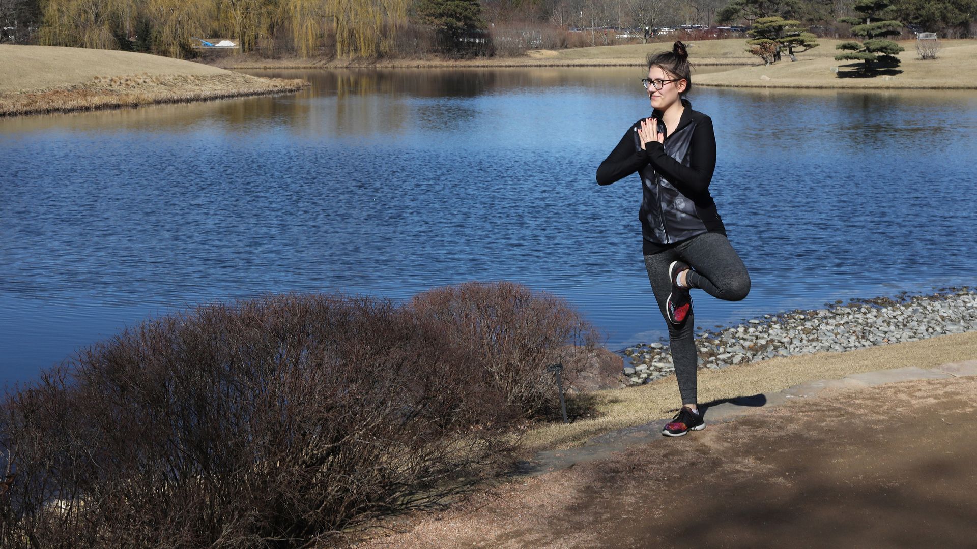 Victoria Kainz practices her yoga as hundreds of visitors take advantage of the unseasonably warm weather to stroll through the garden at the Chicago Botanic Garden on Feb. 18, 2017 in Glencoe, Ill.
