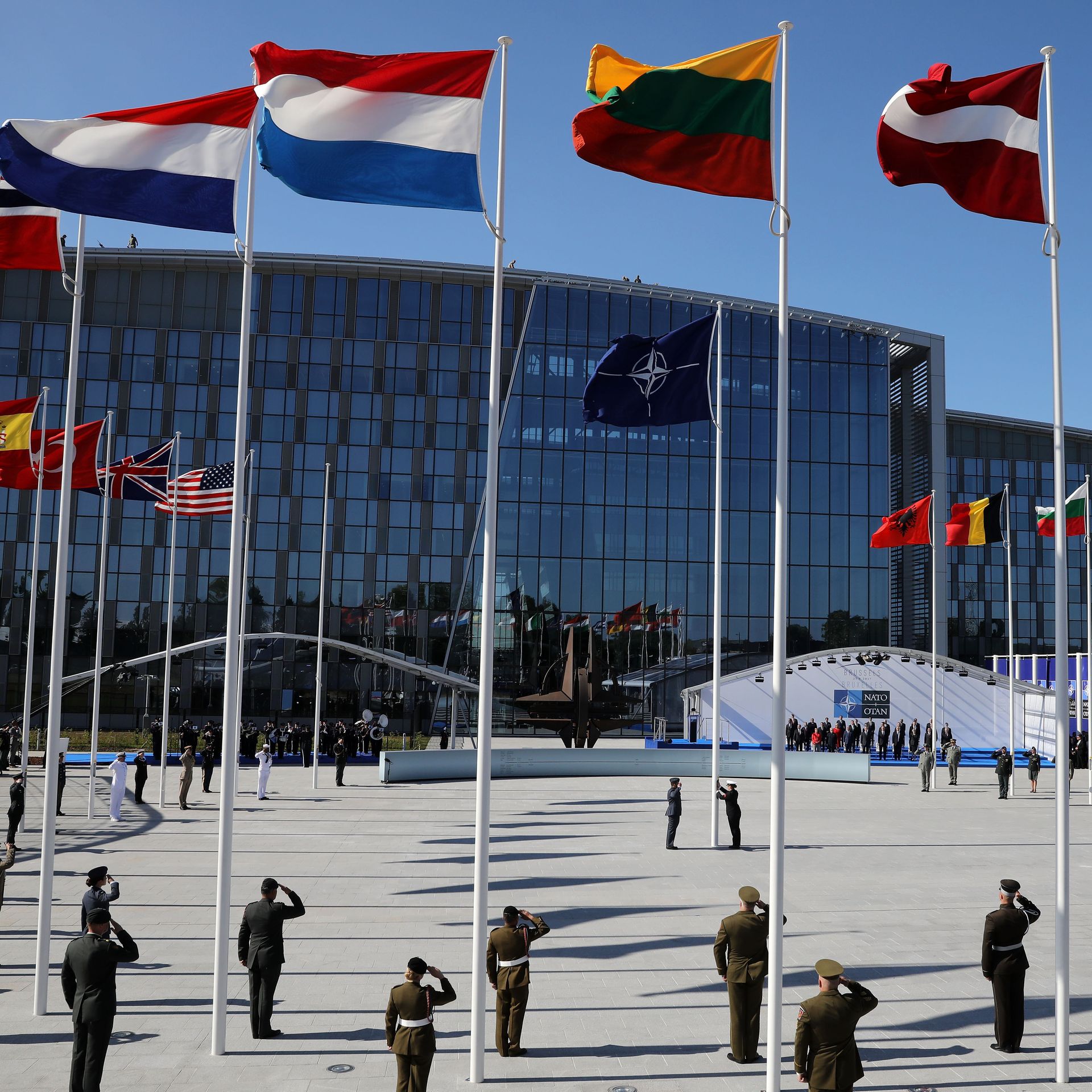 NATO headquarters, with circle of flagpoles and soldiers at attention