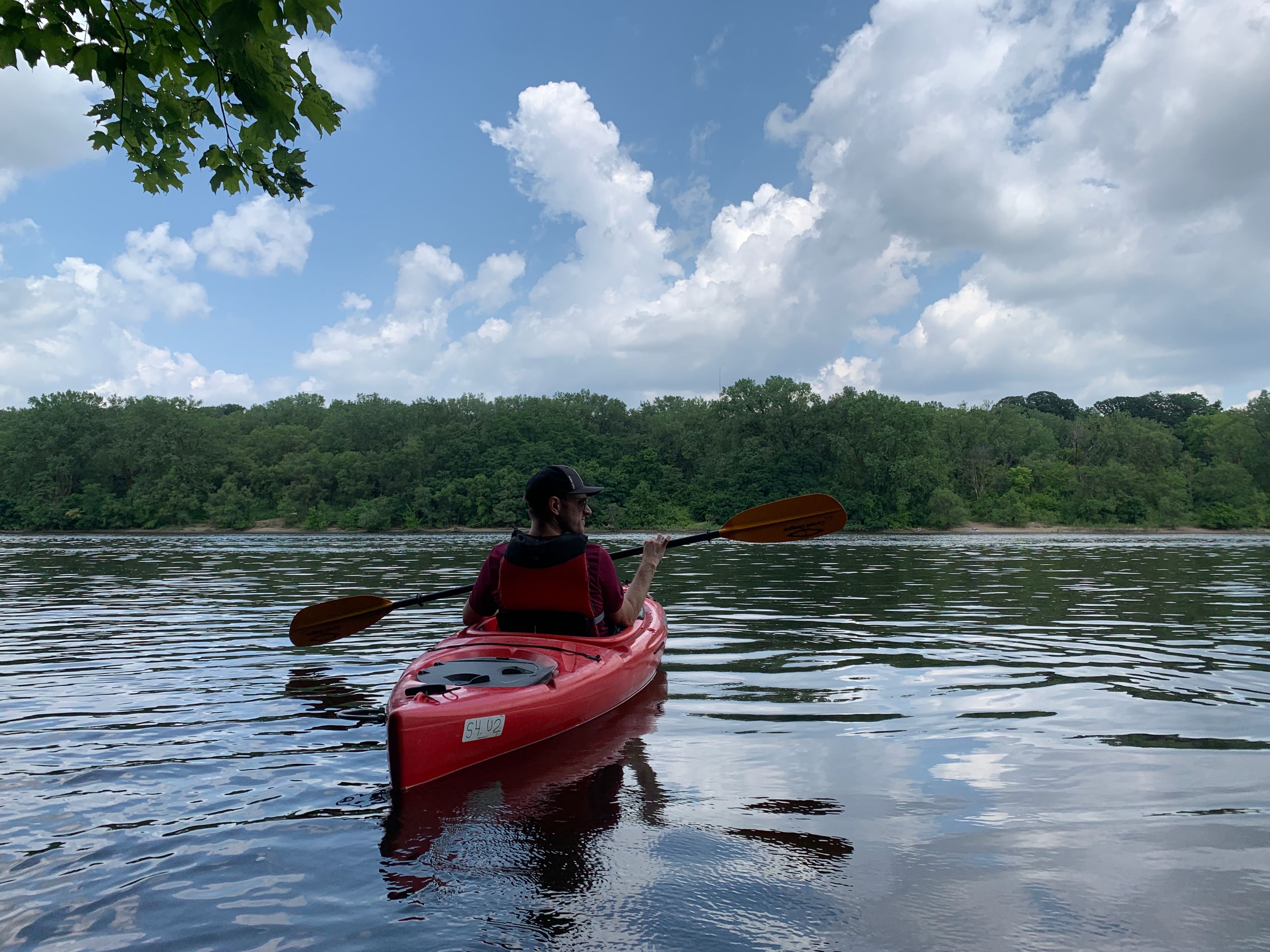 A man in a kayak on a river