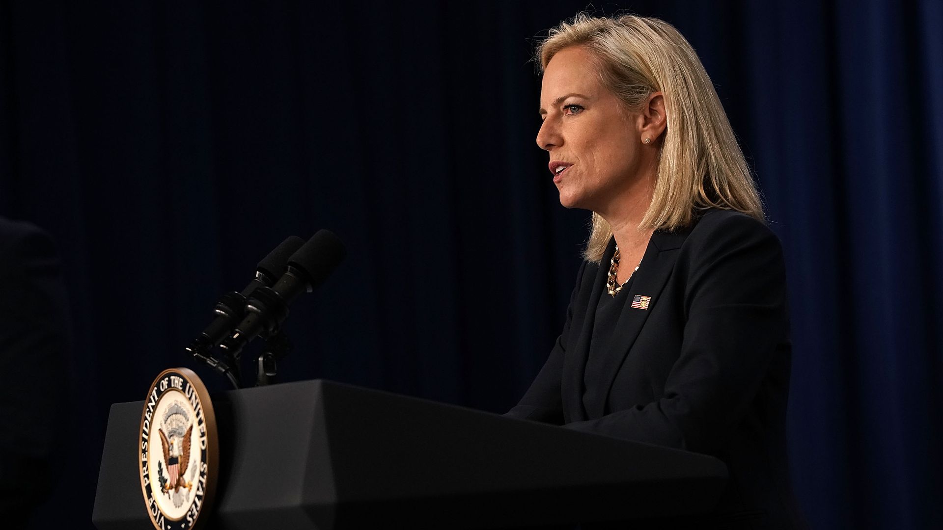 Homeland Security Secretary Kristjen Nielsen at a podium