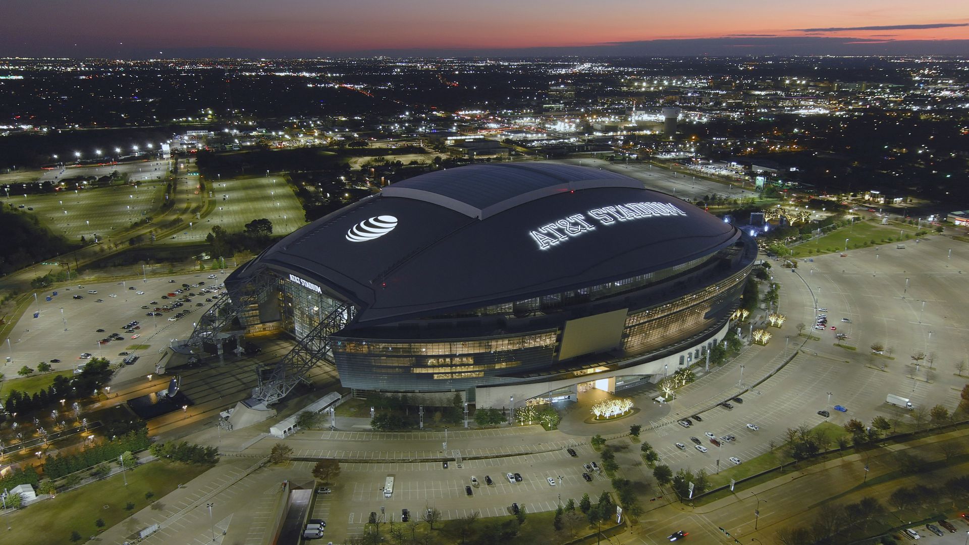 An aerial view of AT&T Stadium around dusk