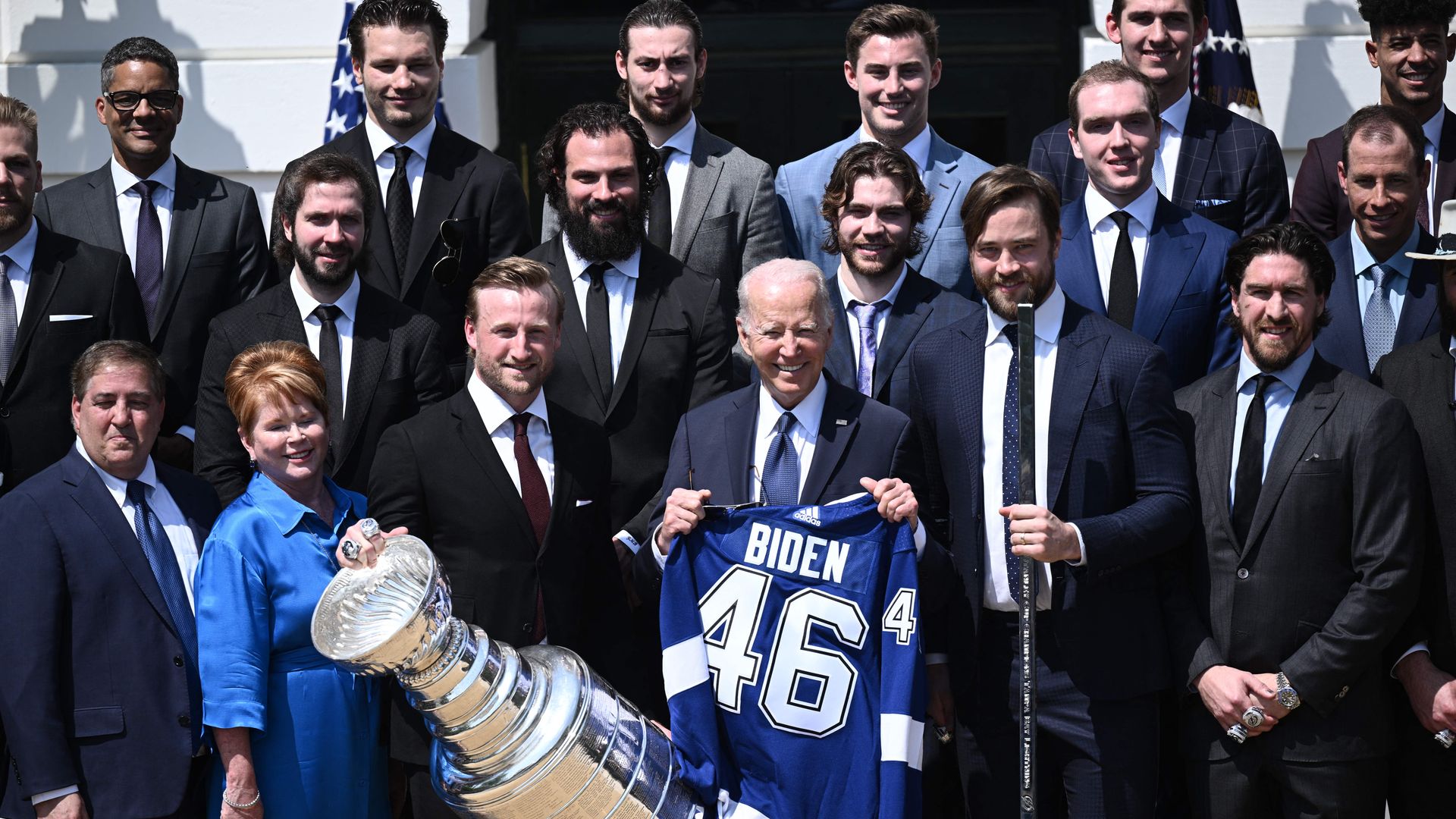 President Biden is seen posing with members of the Tampa Bay Lighting to celebrate their Stanley Cup win.