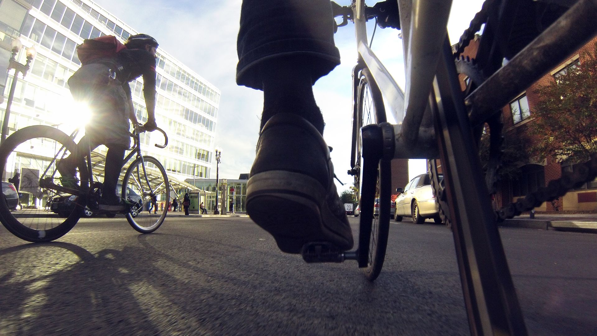 Two bike messengers out on deliveries
