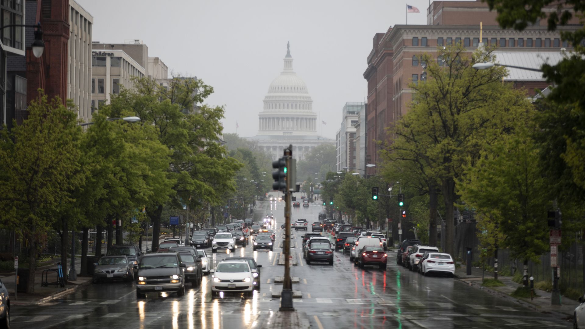 Image of cars on street leading to U.S. Capitol building
