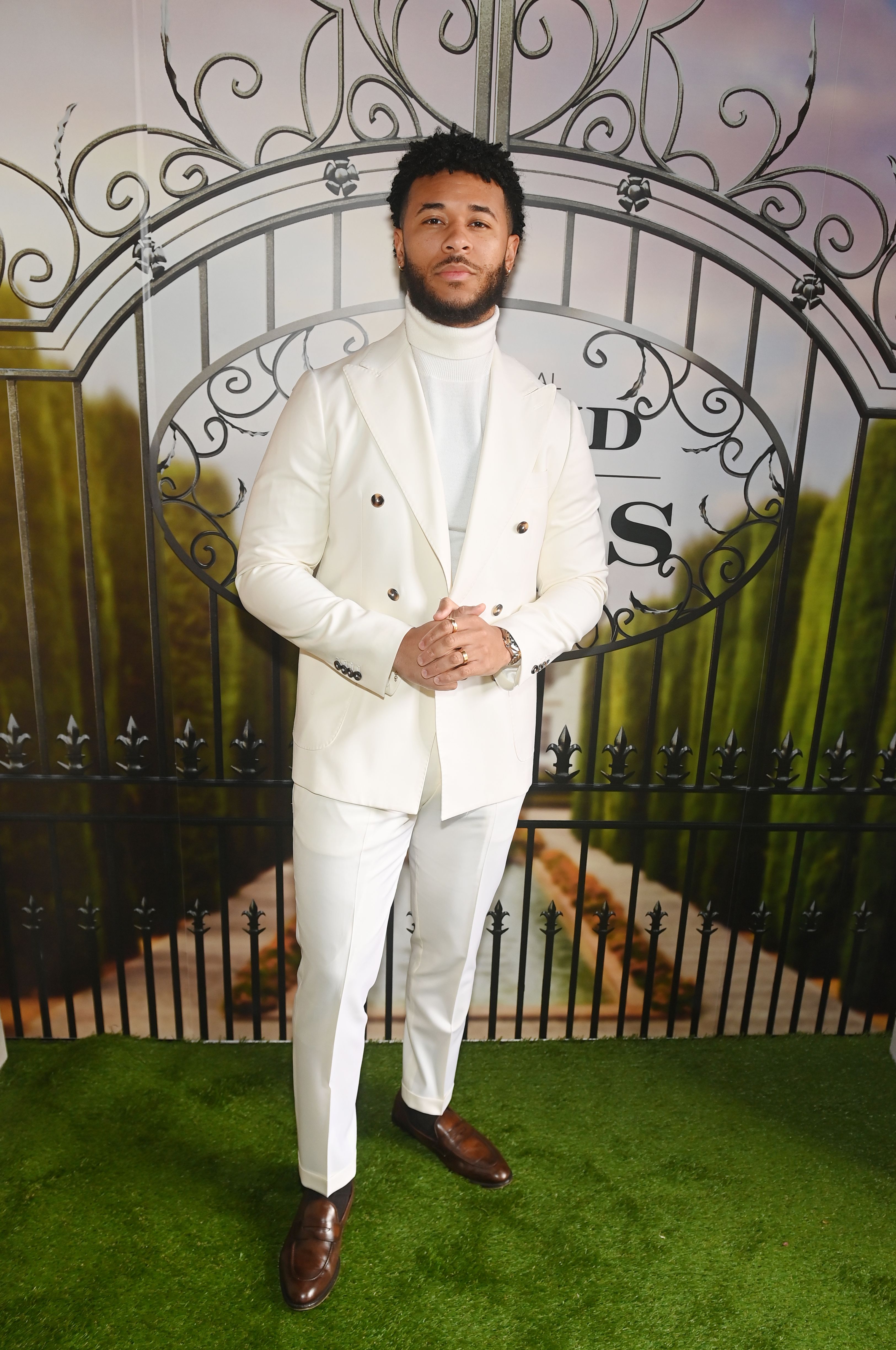 How men of color are redefining style and masculinity with quarter zip sweaters and suits