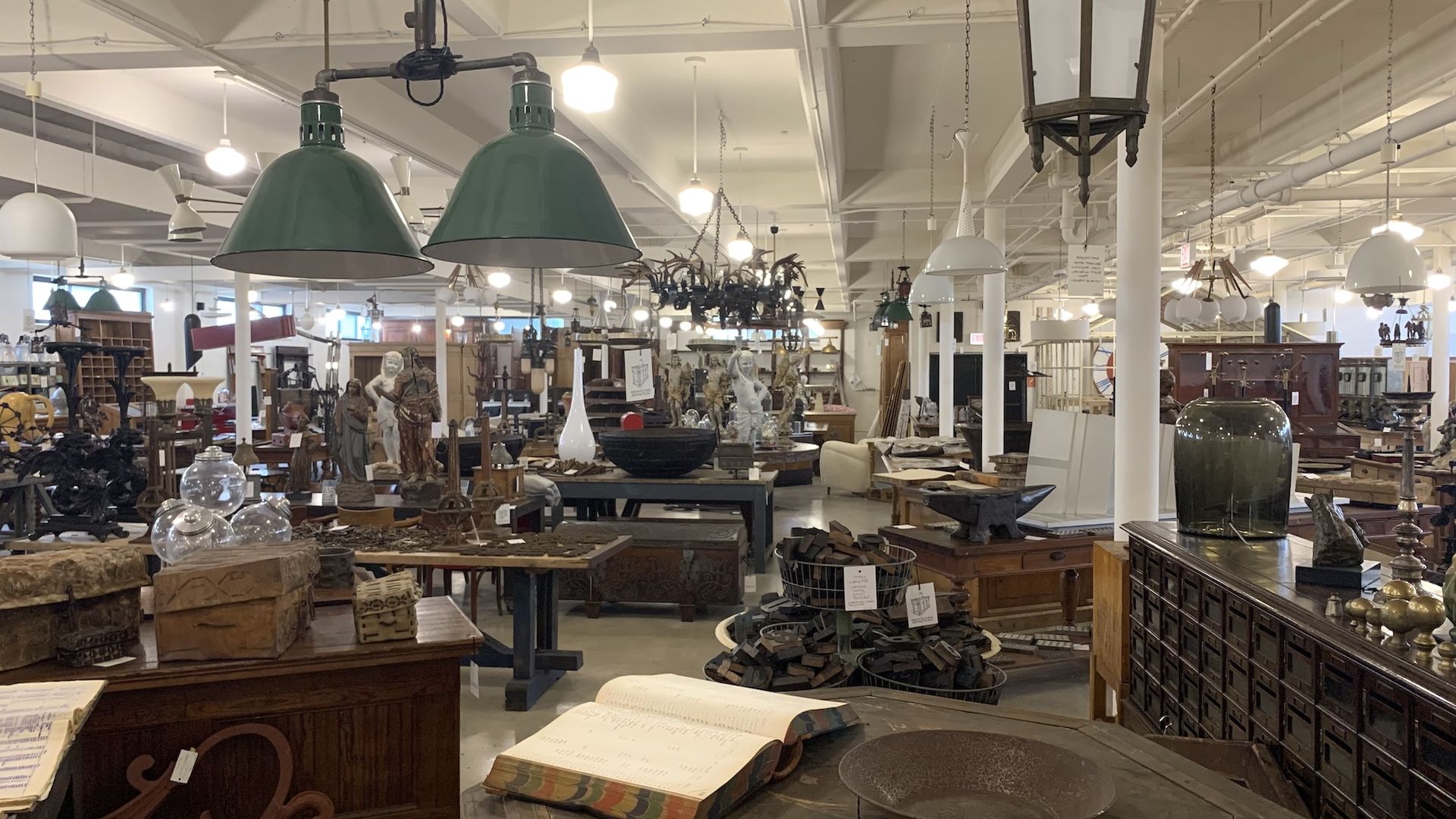 Crowded room with antiques.