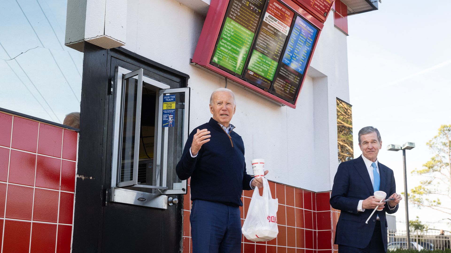 US President Joe Biden holds a milkshake during a quick stop at Cook Out, a restaurant in Raleigh, North Carolina, following an event to promote his economic agenda on January 18, 2024. (Photo by SAUL LOEB / AFP) (Photo by SAUL LOEB/AFP via Getty Images)