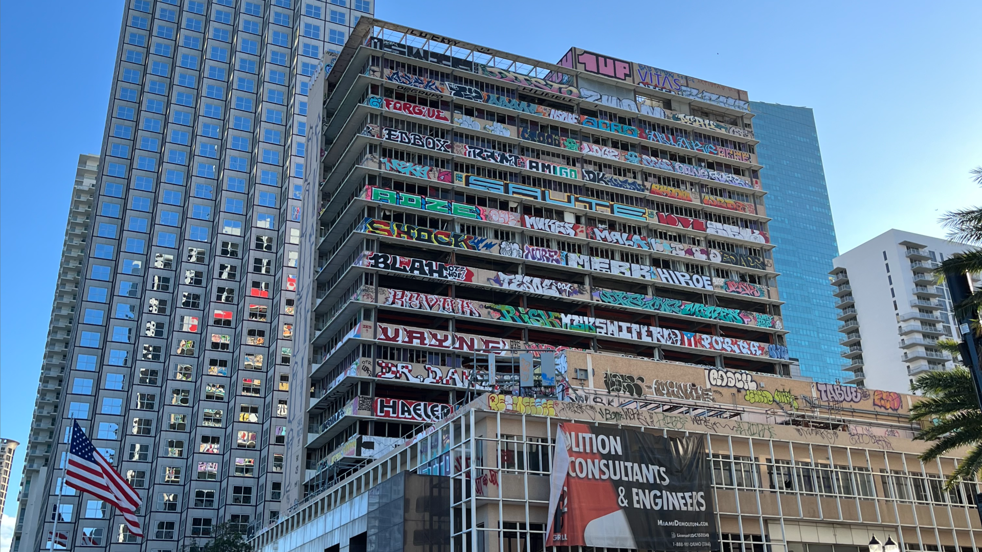 The building at 100 S Biscayne Boulevard, which is covered in graffiti