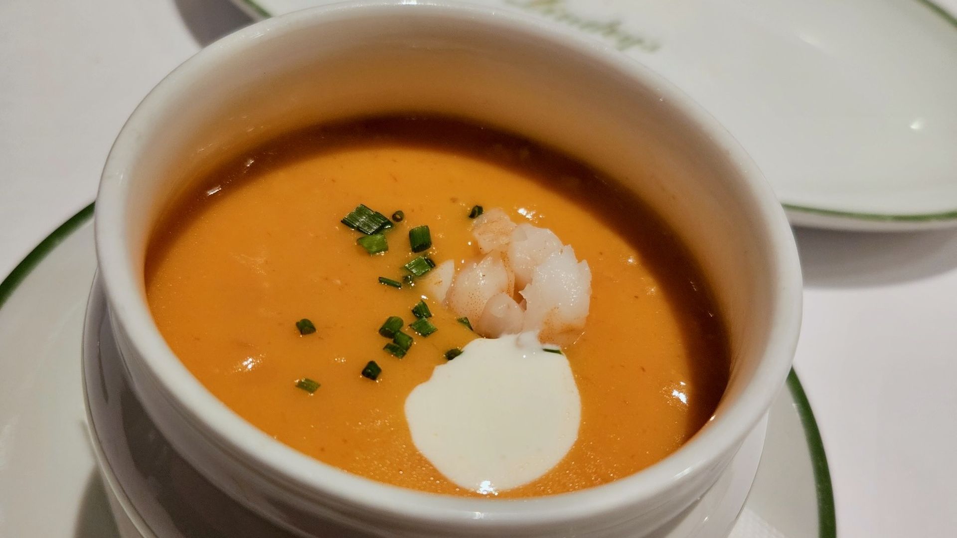 Lobster bisque at Lindey's in a white ceramic bowl