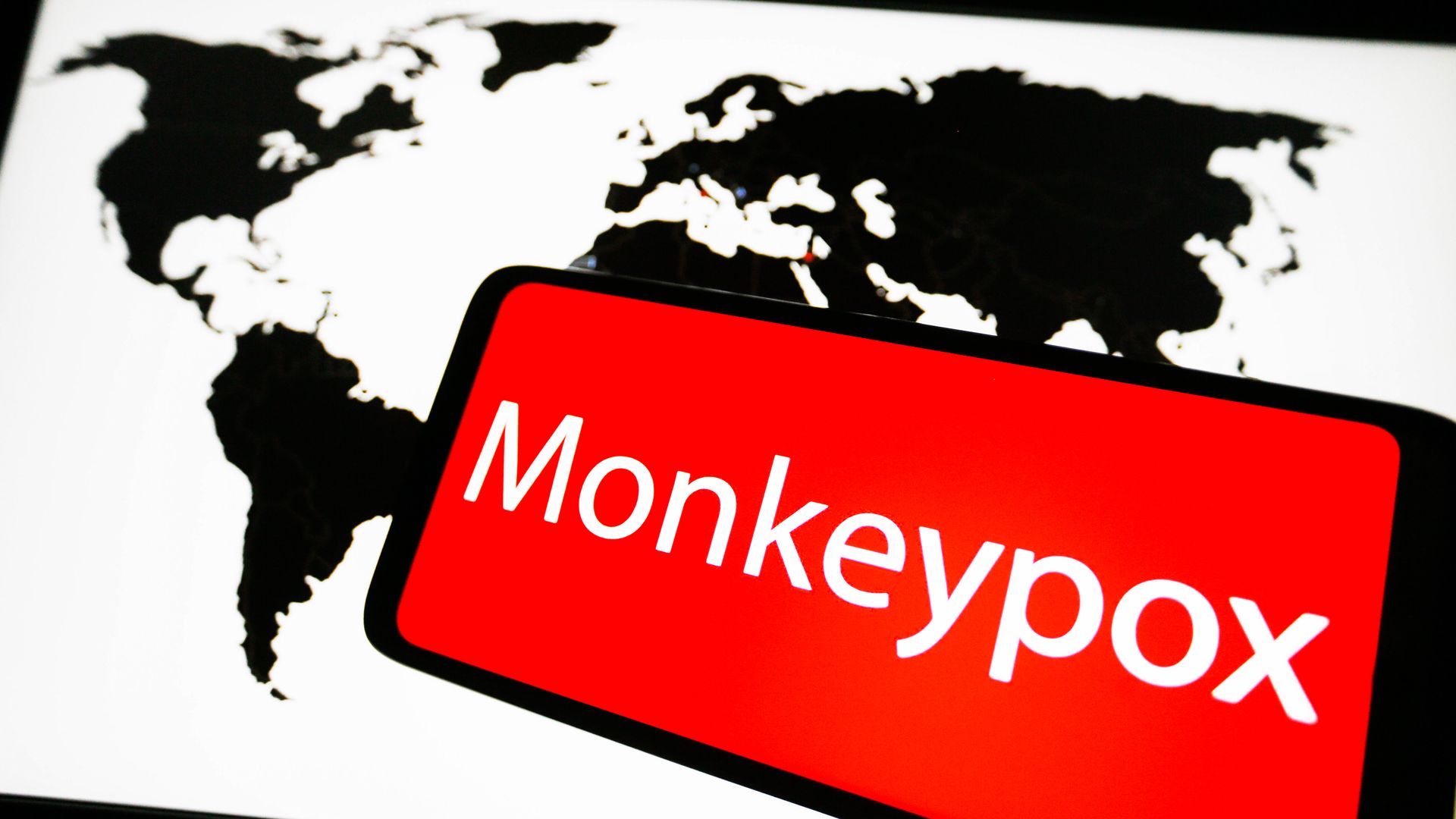  the word Monkeypox is seen on a screen of a smartphone.