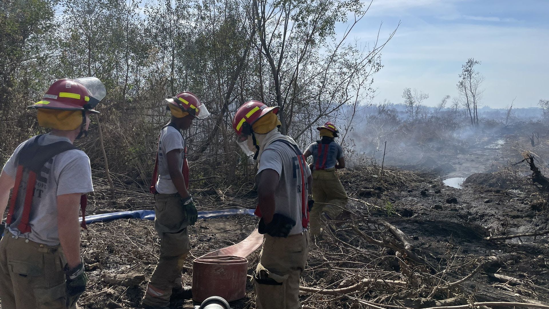 Photo shows New Orleans firefighters responding to an underground fire in New Orleans East