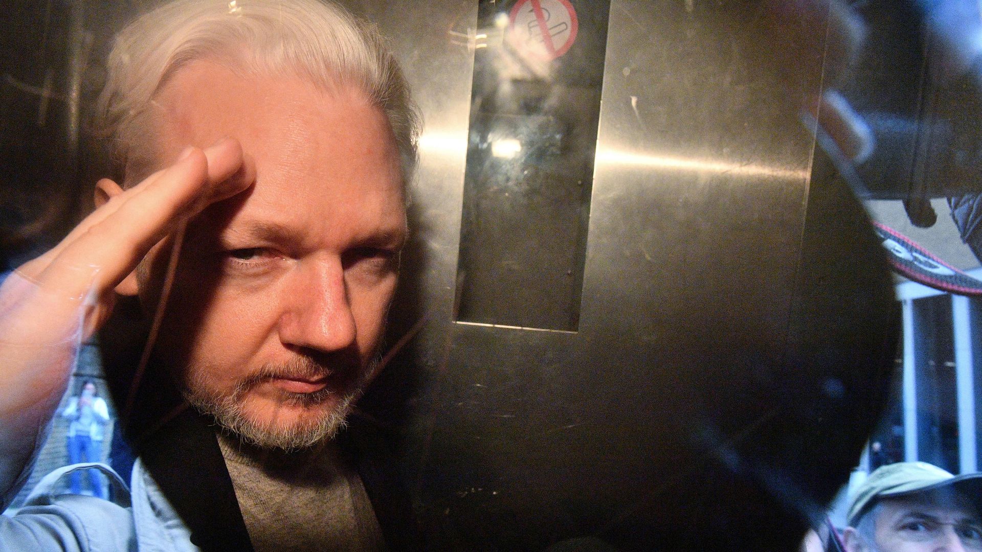 WikiLeaks founder Julian Assange in a prison van outside of a London court in May 2019.