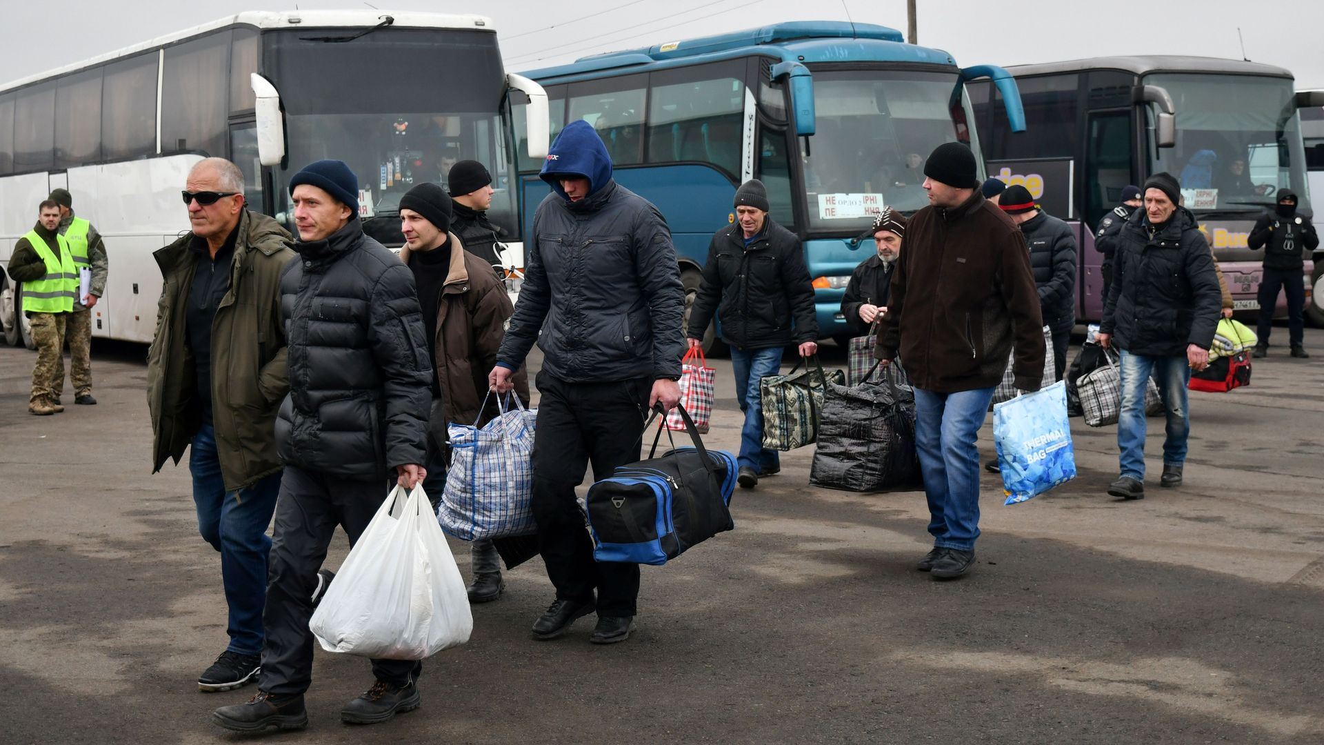 Pro-Russian rebels walk during a prisoner exchange.