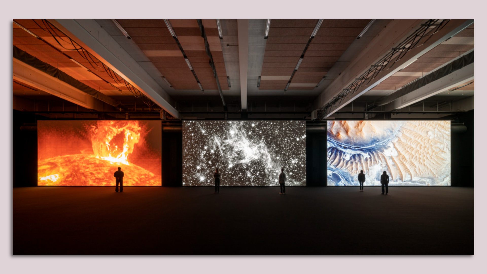 A rendering of people looking at an oversized art exhibition featuring three large panels showing the sun and universe in a dark gallery room