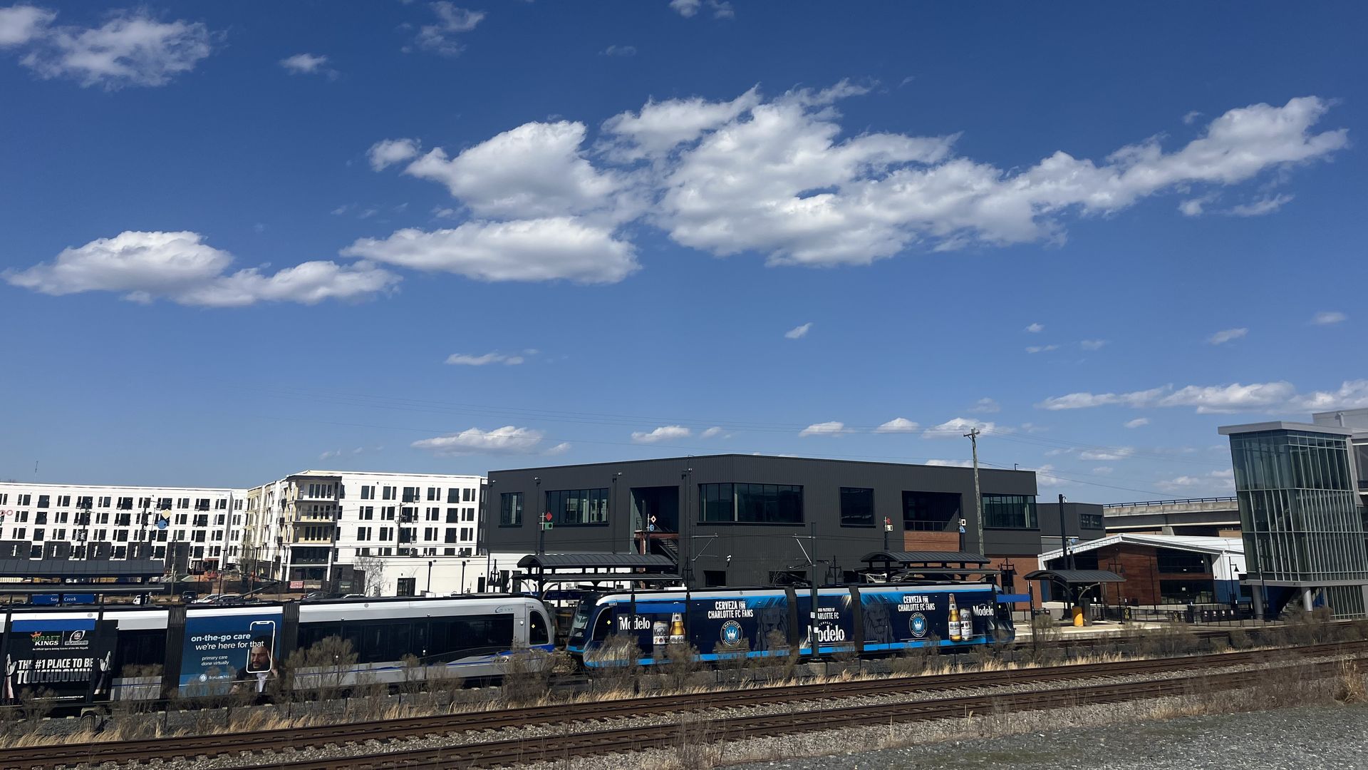 Light rail runs on tracks on a sunny day