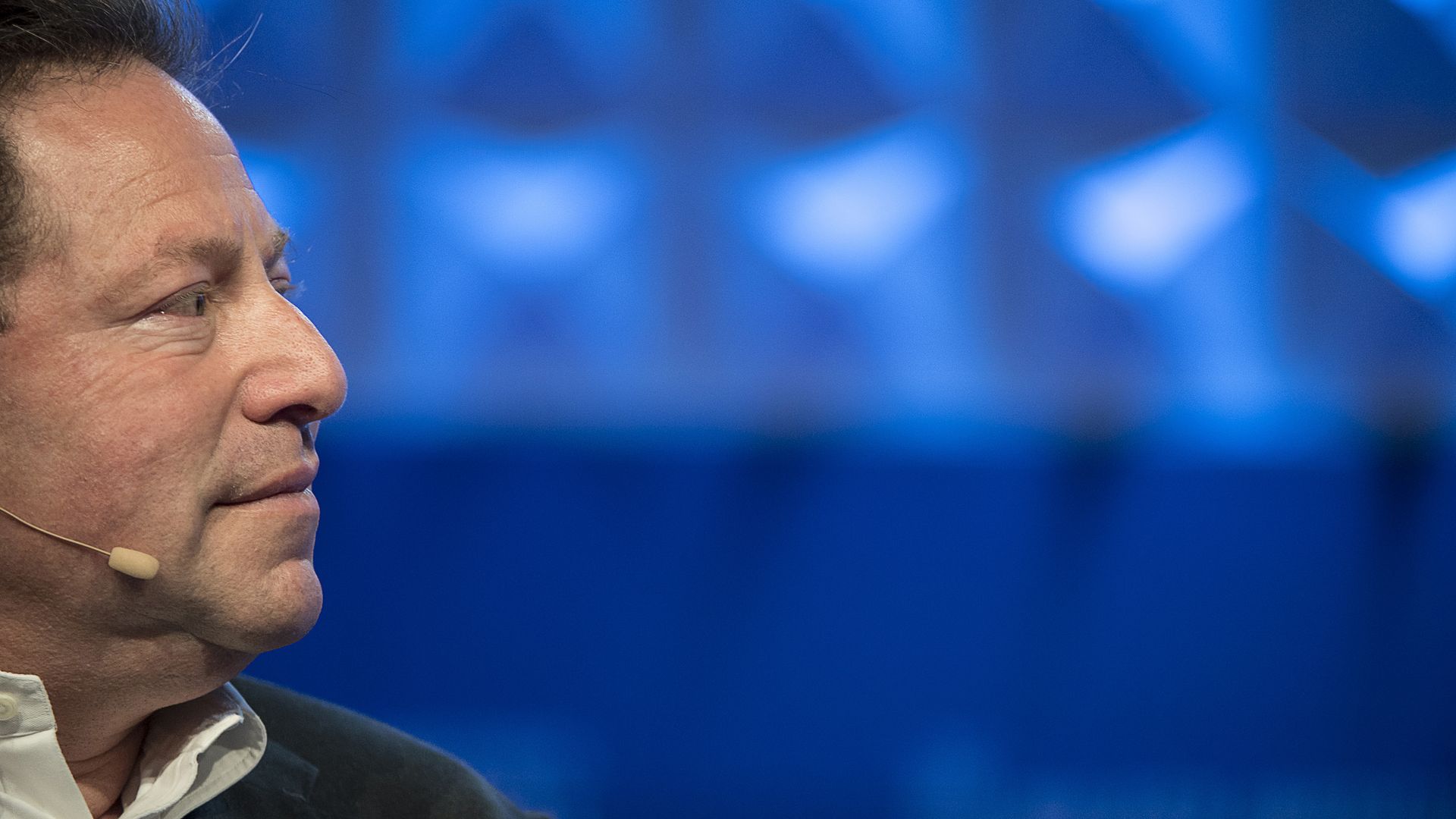 Photo of Bobby Kotick looking to the right in front of a blue background